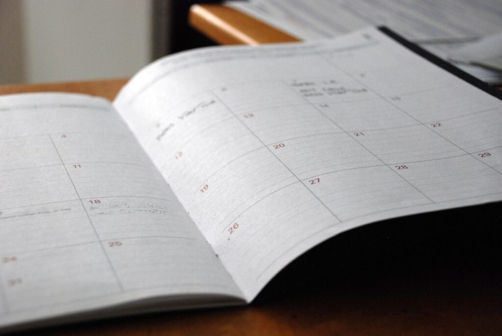 Open planner on desk for exam schedule planning
