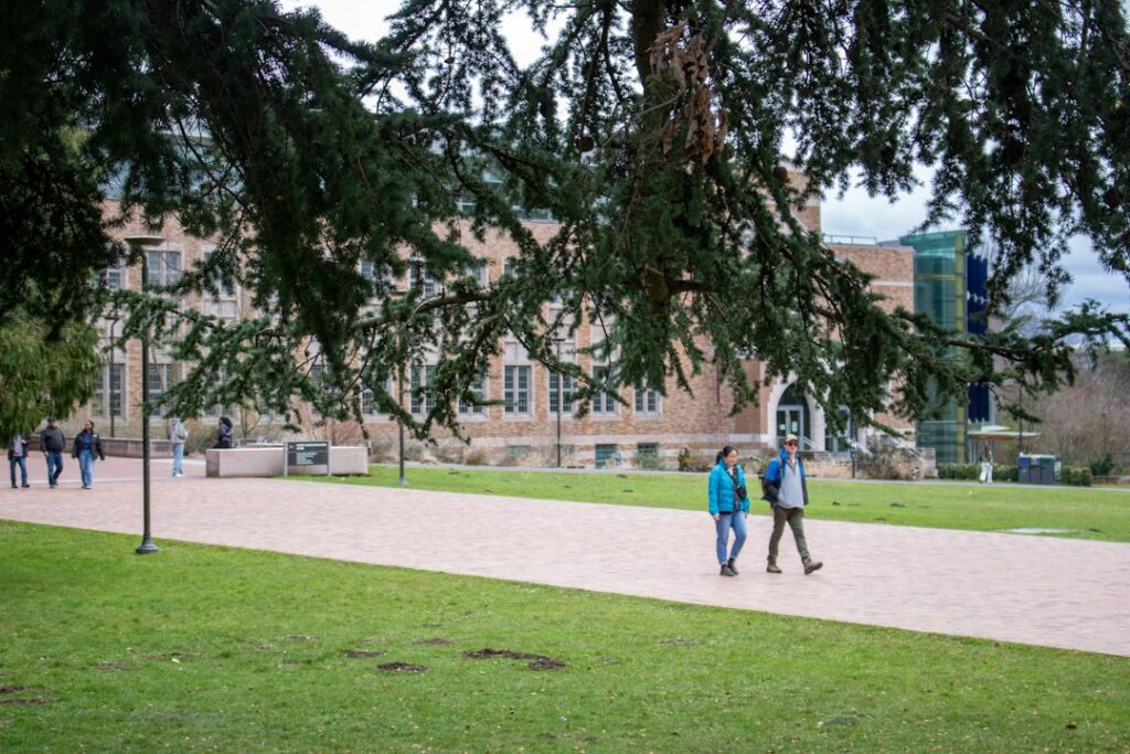 Students walking on university campus for admission